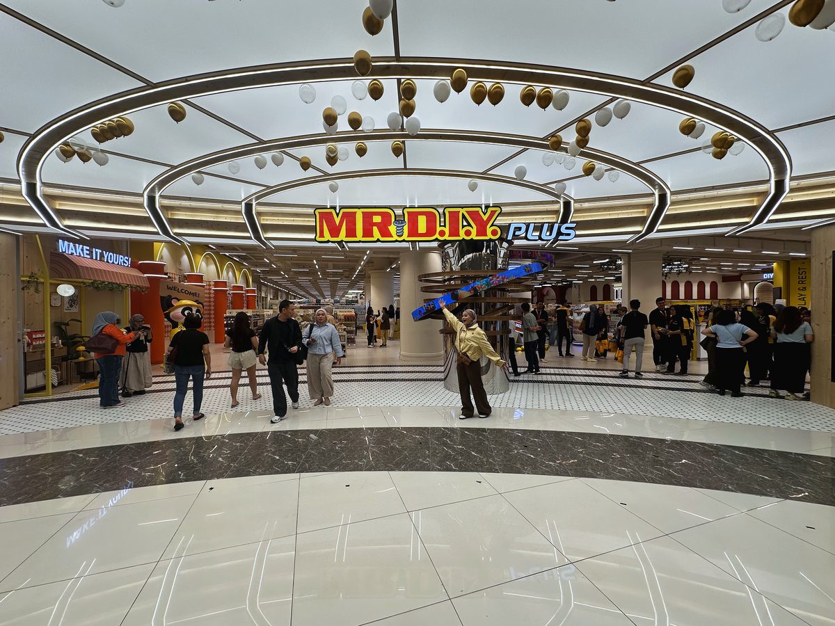Illuminated ring ceiling and pinewood signage band at the MR D.I.Y Plus flagship shopfront